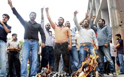 PUSU activists burn an effigy of Dr R.S. Grewal, director UILS, in Panjab University