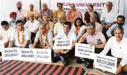 Senate members of Panjab University sit on a relay fast demanding central university status in Chandigarh