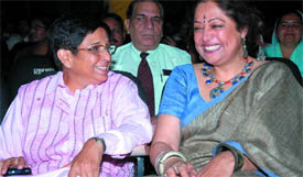 Retd IPS officer and founder chairman of the India Vision Foundation Kiran Bedi with actor Kirron Kher at a seminar on Safety Guidance for Women in Service Industry in the Capital on Monday.
