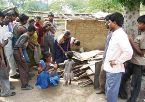 Jhuggi dwellers at the site of the demolition in Ludhiana on Monday.