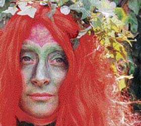 A costumed festival marcher participates in the 'Jack in the Green' procession in Hastings, southern England