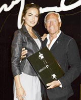Giorgio Armani with actress Camilla Belle at the launch of his first cosmetics counter and sign copies of 