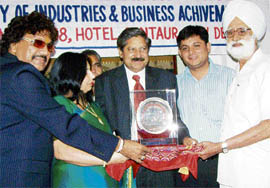 G.K. group managing director Gulshan Kumar being honoured with “Businessman of the Year Award” by Delhi-based Society of Industry and Business Achievements.