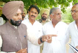 Former MP Jagmeet Singh Brar inspecting canals in Abohar on Wednesday. 