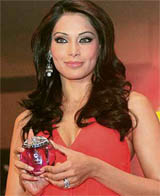 Bollywood actress Bipasha Basu holds a bottle of Alcome perfume at its launch in New Delhi on Wednesday.