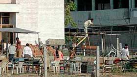 The labourers busy in setting up sheds for lawyers near district courts in Panchkula on Wednesday. 