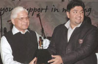 Sunil Duggal, managing director of the Vision Group, a security agency, which has been providing security to the Select City Walk Mall in Saket, receives an award from Union minister Ashwini Kumar.