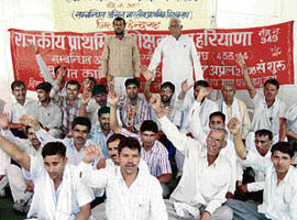 Primary schoolteachers observe a fast and stage a dharna against the privatisation of government primary schools, in Rohtak on Wednesday.