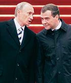 Russia's President Dmitry Medvedev (right) and former President Vladimir Putin talk after the swearing-in ceremony at the Kremlin in Moscow on Wednesday.