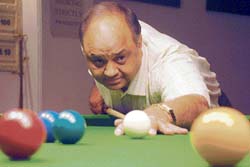 Rajesh Jain plays a shot during a billiards match in Chandigarh on Thursday.