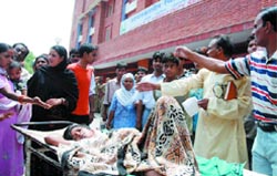 Patients wait outside the emergency ward of the LNJP Hospital during the doctors strike in the Capital