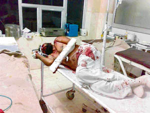 Sita Ram, an accident victim, lies unattended in the Fatehabad general hospital on Wednesday night. 