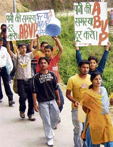 ABVP students hold a march on the HPU campus on Thursday in protest against the shortage of water in hostels