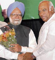 Prime Minister Manmohan Singh being greeted by KPCC chief Mallikarjun Kharge at a party meeting in Bangalore on Thursday. 