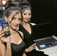 Models display the ASUS Lamborghini notebook and PDA mobile phone at a launch function in New Delhi on Friday. ASUS unveiled the ASUS Lamborghini VX 3 notebook and luxury mobile ASUS Lamborghini ZX1 in India at a cost of Rs 200,000 and Rs 50,000, respectively.