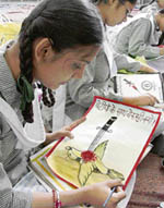 A student paints during a competition at RS Model School, Ludihana, on Friday.