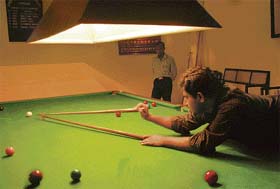 A player attempts a shot during a billiards match at Chandigarh Club