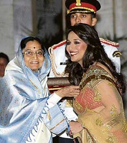 Actress Madhuri Dixit receives the Padma Shri award from President Pratibha Patil at Rashtrapati Bhawan in New Delhi on Saturday. 