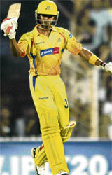 Chennai Super Kings S. Badrinath raises his bat after his 50 against Kings XI Punjab during the IPL T20 match at MAC Stadium in Chennai on Saturday.