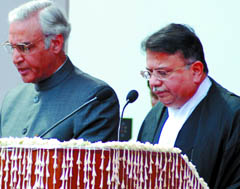 Lt Governor Tejendra Khanna administers the oath of office to Justice Ajit Prakash Shah (R) as the Chief Justice of Delhi High Court in the Capital on Sunday. 