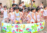 Students of Everest Public School enjoy themselves during a rain dance party in Ludhiana on Saturday.