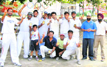 Players of Media XI in jubiliant mood after their win over PCTE XI in a cricket match in Ludhiana on Sunday.