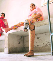A physically challenged woman takes rest inside Lord Mahavira College, Ludhiana, where a function to distribute artificial limbs was organised on Sunday.