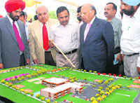 Chief Justice Vijender Jain looks at the model of the Court Complex at Talwandi Sabo on Sunday.