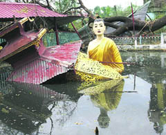 A large statue of Buddha partly submerged in water at a temple that was heavily damaged by last weeks destructive cyclone Nargis, in the outskirts of Yangon, Myanmar, on Sunday.