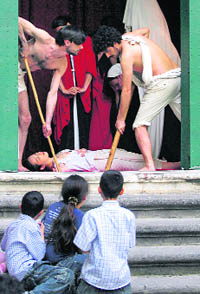 Actors from the Malatheatre troupe recreate Caravaggio's 1606 painting "The Burial of Santa Lucia" in one of the series of 17 tableaux vivants in their production "La Conversione di un Cavallo" in Naples on Saturday. 