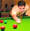 Gurpreet S. Batra aims a shot during a snooker match at Chandigarh Club