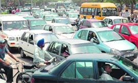 Motorists caught in a traffic jam at the Sector 35, 34, 22 and 21 rotary in Chandigarh