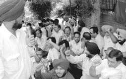 BSNL employees stage a dharna in Sector 34 in Chandigarh
