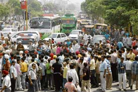 Traffic chaos at Ferozepur road where a bus was burnt to ashes in Ludhiana on Monday.