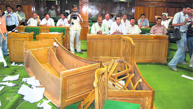 Tables and chairs overturned by opposition members in Uttarakhand assembly on Monday.