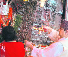 Nepals King Gyanendra and Queen Komal offer prayers at Dachinkali temple on the outskirts of Katmandu on Monday. In a rare public appearance on Monday, the King took part in a religious ceremony just weeks before he is likely to be dethroned by a special assembly elected last month.