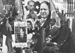 A member of a civil society holds a portrait of deposed Chief Justice Iftikhar Mohammed Chaudhry during a rally for the restoration of deposed judges in Islamabad on Monday.