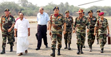 Union Minister of Defence A.K. Antony being escorted by senior Army officials at the Golf Range helipad in Ferozepur