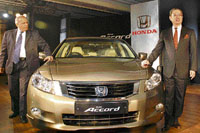 President and CEO of Honda Siel Cars (HSCI) India, Masahiro Takedagawa (R) and chairman of Honda Siel Cars India (HSCI) Sidharth Sriram at the launch of new Honda Accord in New Delhi on Tuesday.