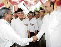 Dr M.M. Pallam Raju, minister of state for defence, being welcomed by an ex-serviceman during his visit at the Rajya Sainik Board, in Sector 12, Panchkula, on Tuesday.