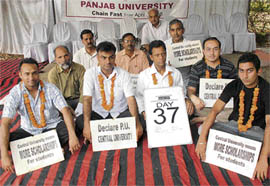 Students and teachers of Panjab University at a relay fast in Chandigarh on Tuesday. 