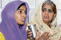 Jasbirs sister Neelam (with folded hands), along with her mother Saroj, interacts with mediapersons in Karnal