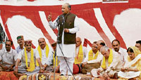 Chief Minister Prem Kumar Dhumal addresses a public meeting at Karer on Tuesday.