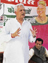 Congress candidate O.P. Rattan addresses a public meeting at Dhaned on Tuesday.
