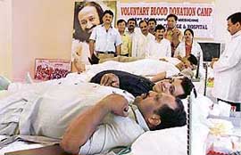 Volunteers donate blood at a blood donation camp organised by Art of Living Foundation in Ludhiana on Tuesday.