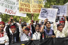 Victims of the Bhopal gas tragedy demand medical care and rehabilitation during a rally in New Delhi