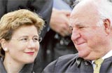 In this August 21, 2005, file photo, former German Chancellor Helmut Kohl (right) and his partner Maike Richter attend a Mass at Marienfeld, southwest of Cologne, Germany