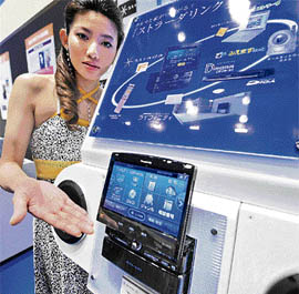 A model displays Panasonic's new HDD car navigation system "Stranda F-Class" in Tokyo on Wednesday.