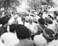 Congress supporters protest outside the counting centre in Government College in Dera Bassi on Wednesday.