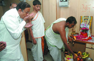 Union minister of finance P. Chidambaram offers pooja during the inauguration of 1st Micro Finance branch at Mukundpur near Burari in the Capital on Wednesday. 